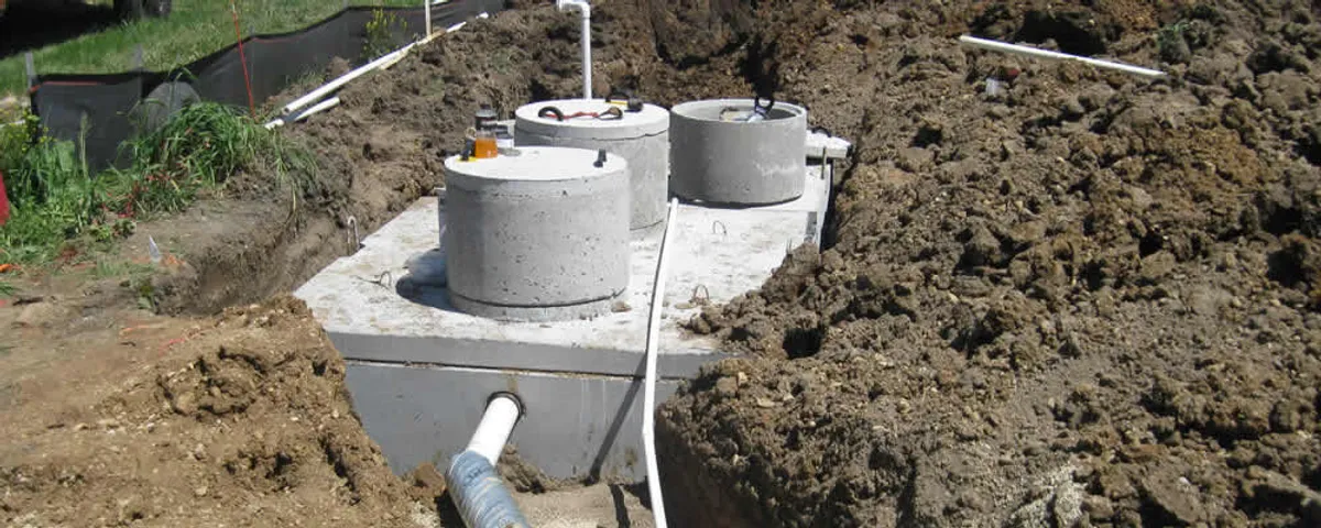 Septic system repair and installation site with tank access ports in Peoria, IL