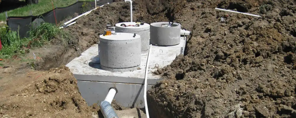 Septic system repair and installation site with tank access ports in Peoria, IL